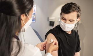 Receiving a booster shot